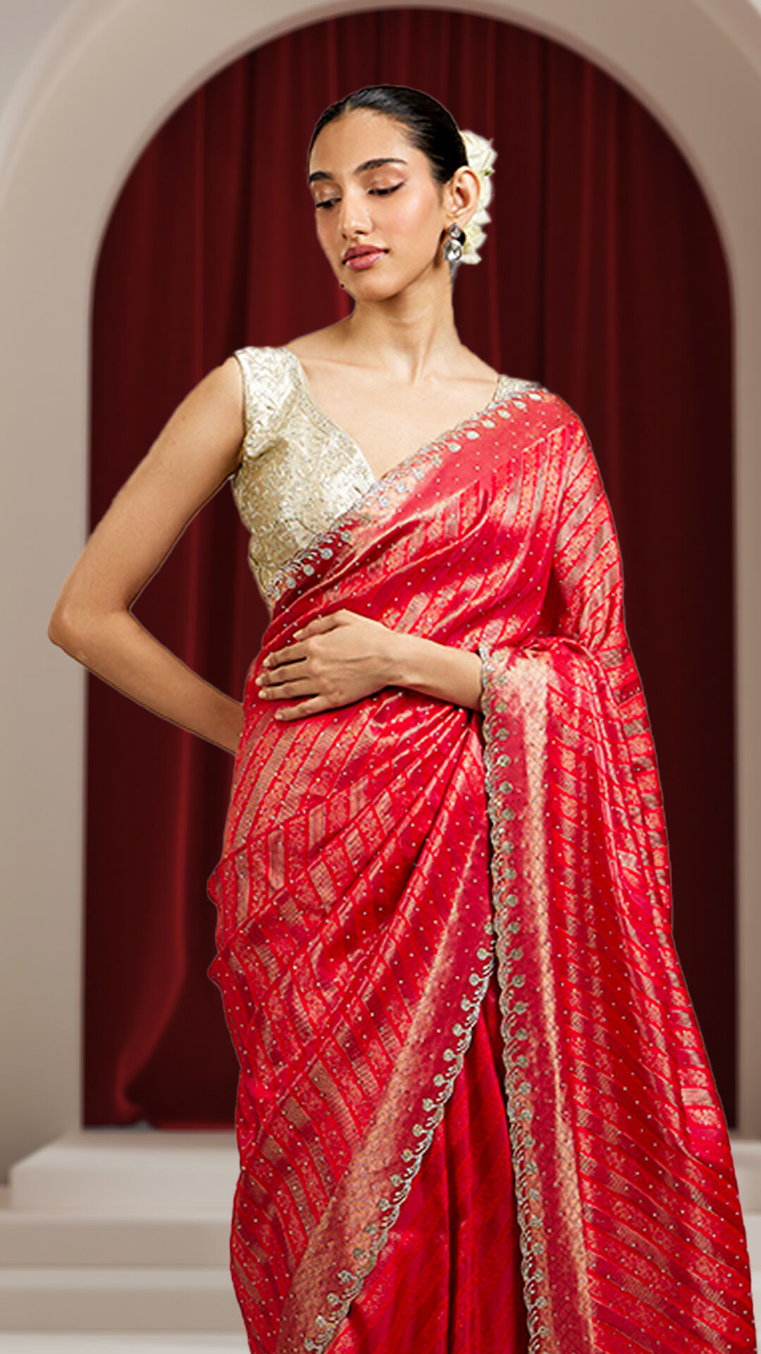 Woman wearing a traditional red saree for a wedding celebration